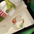 Bracciale di lucite e perle colorate con decorazioni a glassa natalizia, stile di lusso, modello Beaded di Valstrend.