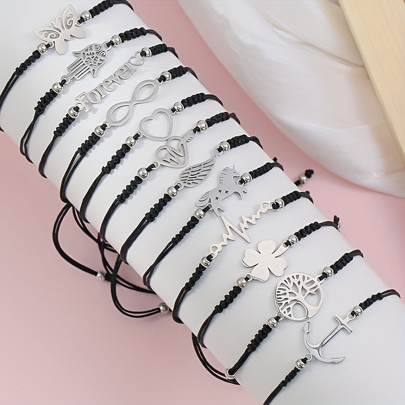 Set di 12 braccialetti unisex con charms Fatima, unicorno e cuore in acciaio inox, con corda nera regolabile.