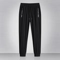 Pantaloni maschili estivi Valstrend in seta sottile, quick-drying, casual e larghi per corsa e relax, visibili in immagine.