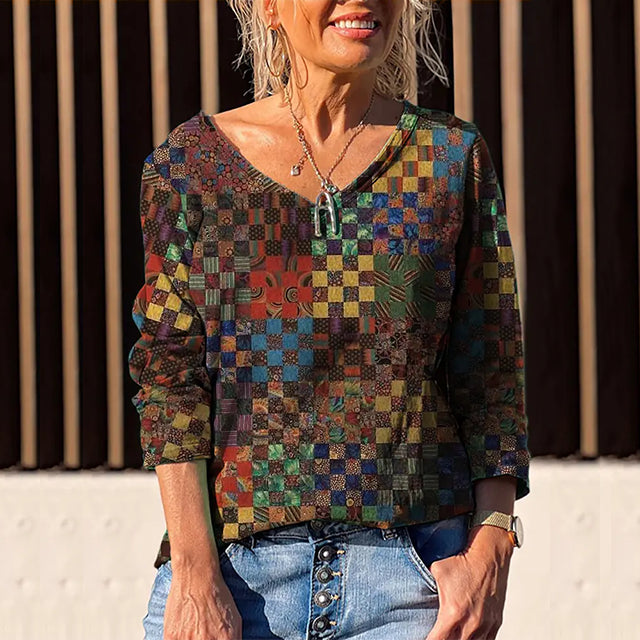 Blusa oversize a maniche lunghe con scollo a V e stampa floreale, marca Valstrend, tessuto morbido e leggero.