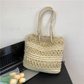 Borsa francese vintage a intreccio vuoto con spalla, stile retrò, in tessuto naturale, con dettagli eleganti e manico robusto.