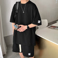 Completo sportivo casual da uomo Valstrend con maglietta a maniche corte e pantaloni waffle, stile rilassato e comodo.