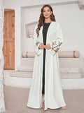 Vestito donna Valstrend con cardigan a maniche lunghe e ricami, elegante e femminile, mostrato con dettagli di ricamo sulla parte superiore.