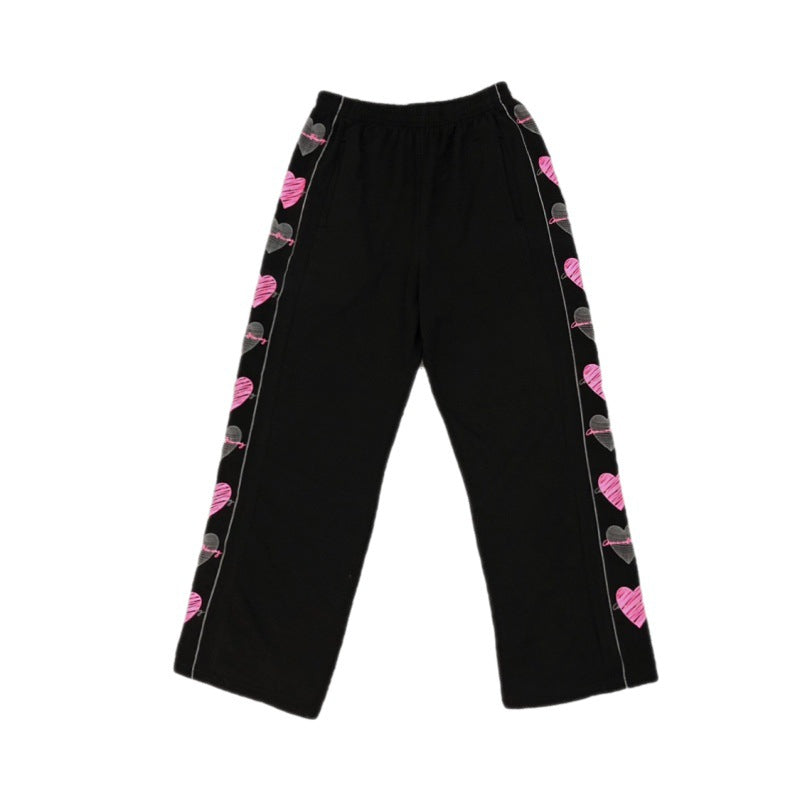Pantaloni larghi a gamba dritta Core Graffiti Valstrend, pantaloni in tessuto con stampa graffiti e vestibilità comoda.