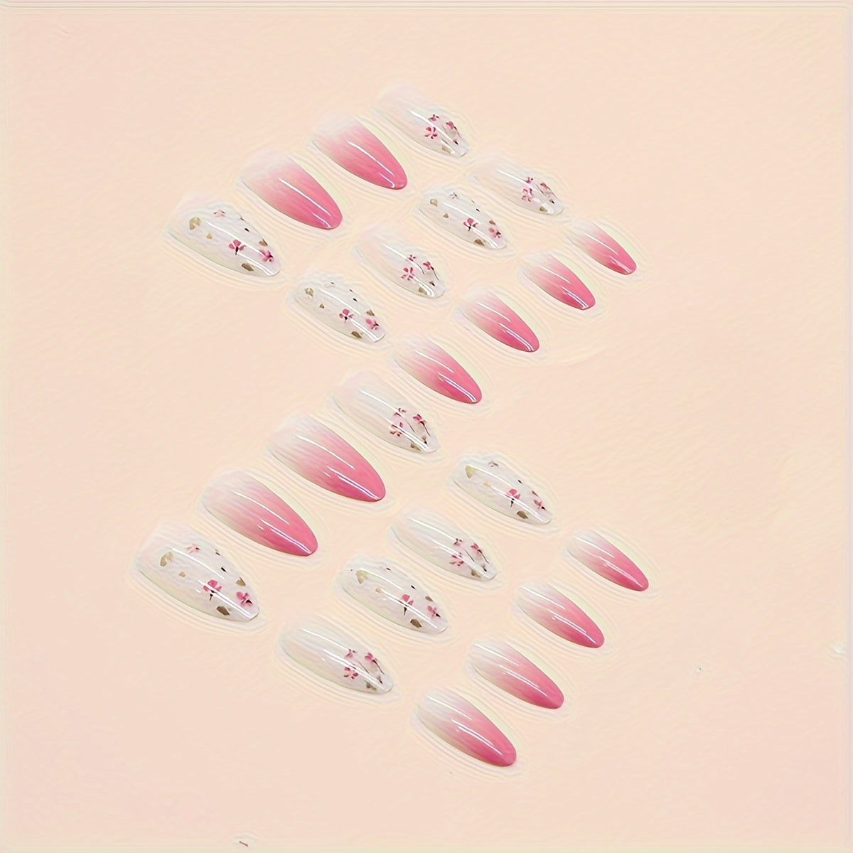 Set di unghie finte a mandorla rosa con design floreale e adesivo gel, lunghezza media, finitura lucida per donne e ragazze.