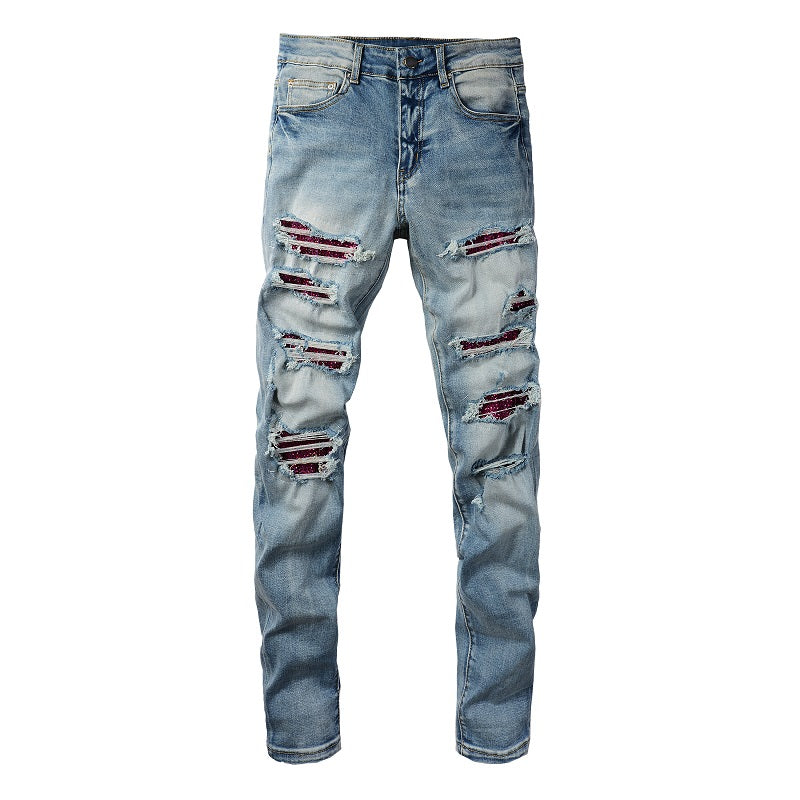 Jeans slim elastic con fori perforati per uomo, marca Valstrend shop, vestibilità aderente e stile moderno.