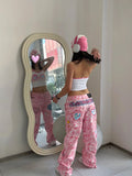 Jeans donna a zampa larga con stampa camouflage retrò di Valstrend, tessuto resistente, moda casual e stile vintage.