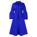 Vestito lungo a vita alta con maniche a sbuffo, fiocco e dettagli in pizzo, marca Valstrend shop.