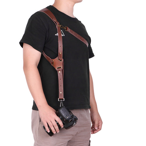 Cinghia a tracolla per fotocamera in vera pelle Sajishop, regolabile e resistente, visibile con dettagli in pelle e fibbie robuste.
