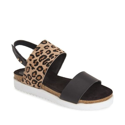 Scarpe JOLLEEN Sajishop nere con stampa leopardata, suola piatta e dettagli eleganti, visibile in primo piano sull'immagine.