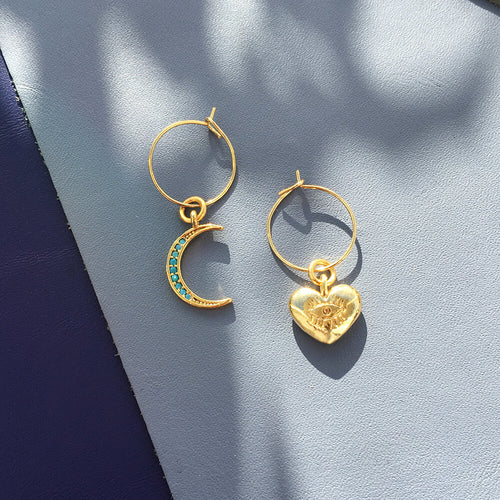 Orecchini a forma di luna in cristallo di Sajishop, dettagli brillanti e eleganti, adatti a ogni stile.