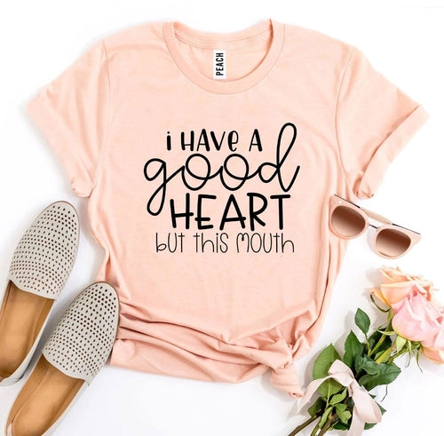 Maglietta bianca Sajishop "I Have a Good Heart But This Mouth" con stampa, tessuto morbido e taglia 3XL, vista frontale.